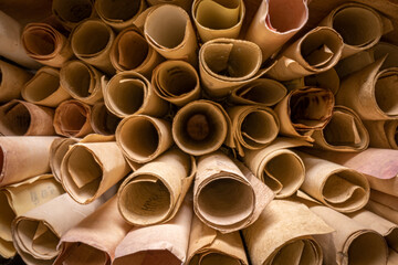 Scribe library. Retro futhpak scrolls stacked on a pile.