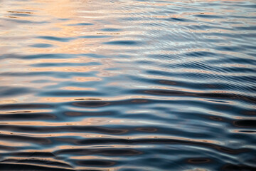 Ripples in sea water at sunset