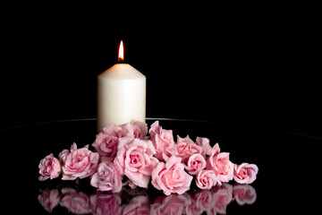 LIGHTED CANDLE AND PINK ROSES ARRANGEMENT ON DARK BACKGROUND. DEEPEST SYMPATHY AND CONDOLENCE CARD....