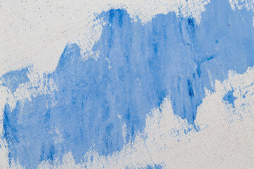 creative background, stain of colored primer rubbed on the surface of a linen canvas, temporary...