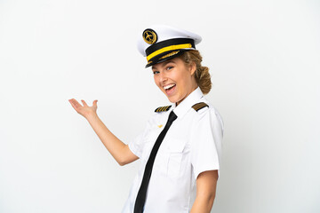 Airplane blonde woman pilot isolated on white background extending hands to the side for inviting to come