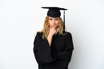 Young university graduate isolated on white background thinking