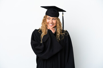 Young university graduate isolated on white background looking to the side and smiling