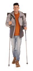 Male hiker with backpack and trekking poles on white background