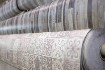 Linoleum of different colors in rolls in a construction store.