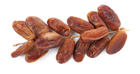 Sweet dates on branch against white background, top view. Dried fruit as healthy snack