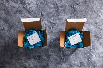 online delivery parcel boxes with Product 1 and 2 on tags, competitions and customer choices