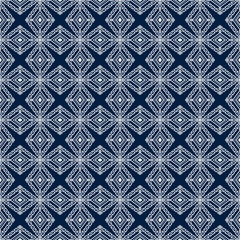 White Tribal or Native Seamless Pattern on Blue Background in Symmetry Rhombus Geometric Bohemian Style for Clothing or Apparel,Embroidery,Fabric,Package Design