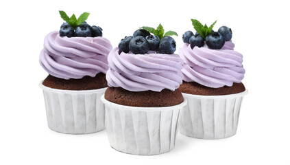 Sweet cupcakes with fresh blueberries on white background