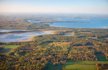 Aerial view of fields and trees in autumn color and lakes near Brainerd Minnesota © Daniel Thornberg