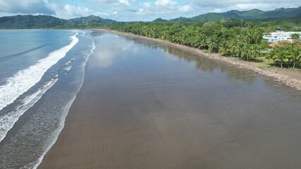 a beach with a mountain in the background