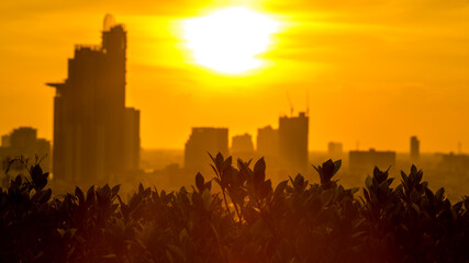 The high angle background of the city view with the secret light of the evening, blurring of night lights, showing the distribution of condominiums, dense homes in the capital community