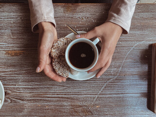 hands holding coffee cup