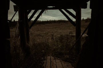 scary abandoned village house with a monster. Halloween themed photo