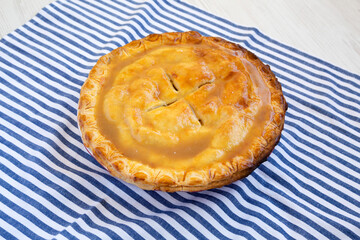Fresh Homemade Salted Caramel Apple Pie, side view.
