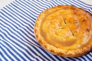 Fresh Homemade Salted Caramel Apple Pie, low angle view. Space for text.