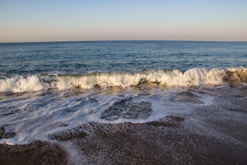 Beautiful seascape with sea waves and sand. Sea waves on the beach.