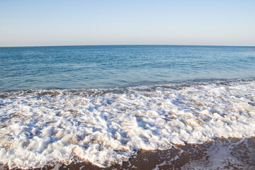 Beautiful seascape with sea waves and sand. Sea waves on the beach.