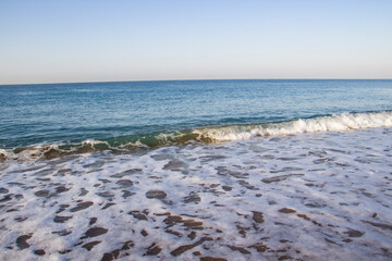 Beautiful seascape with sea waves and sand. Sea waves on the beach.