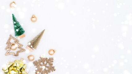 Fototapeta na wymiar Christmas decoration snow. Happy new year ornament with golden balls, xmas holiday tree. White winter snow background. Minimal flat lay.