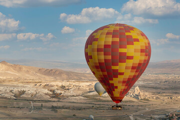 Colorful balloons floating in the blue sky of Cappadocia
