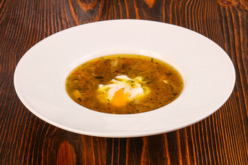 Chicken soup with poached egg