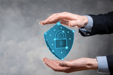 Businessman hold low poly polygon shield with a padlock icon.Secure Access System Concept.Business...