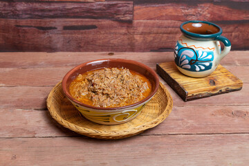 Mexican food, authentic beef birria with cup of Mexican coffee