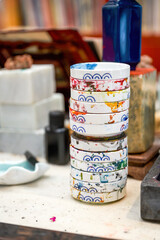 Close-up of a stack of ink plates in a calligraphy art studio