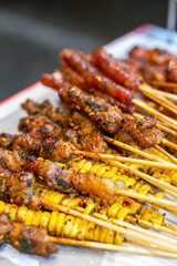 A plate of grilled skewers with rich ingredients