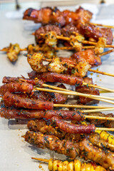 A plate of grilled skewers with rich ingredients