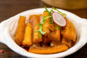 An appetizing cold dish, pickled radish in sauce