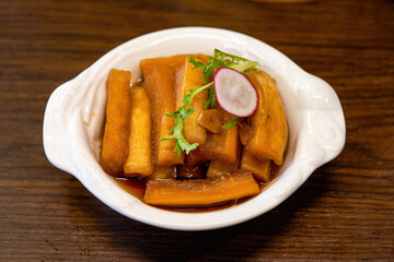 An appetizing cold dish, pickled radish in sauce