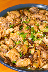 A delicious steamed chicken with shiitake mushrooms