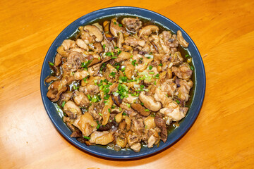 A delicious steamed chicken with shiitake mushrooms