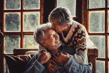 Senior people at home in love kissing and caring each other. Happy relationship mature man and...