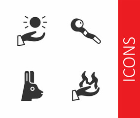 Set Hand holding fire, Ball levitating above hand, Rabbit with ears and Magic staff icon. Vector