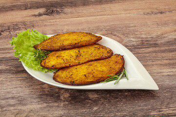 Baked potato with herbs and spices
