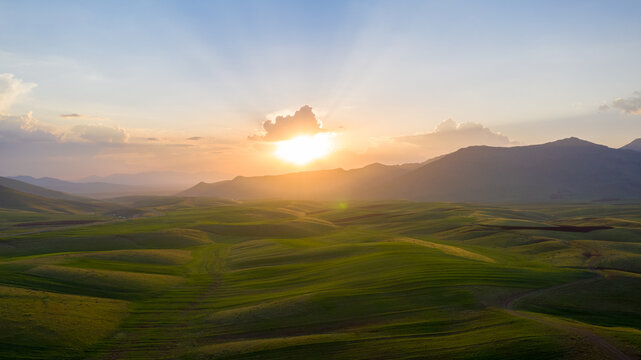 sunrise over the farm hills