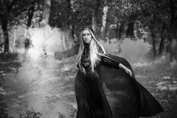 Naklejka premium Dark mystical forest, Halloween ideas for party, outfits for ladies, concept of wizards and magic