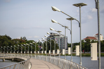Solar street light poles led by a panel system on both sides of the bridge are located in the...