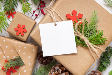 Christmas present with square blank gift tag top view, Mockup