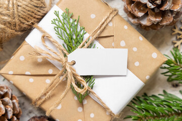Christmas present with blank gift tag top view, Mockup