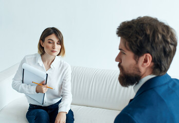 man and woman communicate work team documents