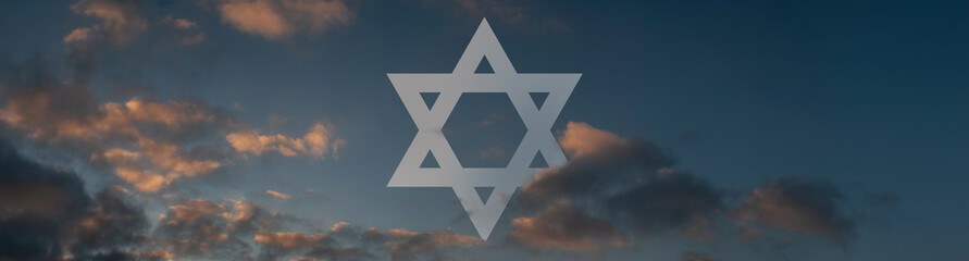 Symbol of Israel. David star amogst the clouds during early sunrise. 
