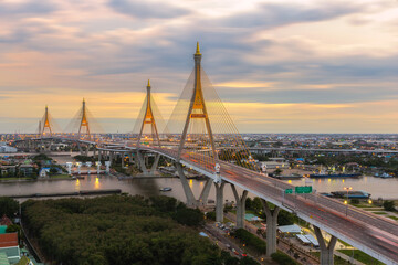 Fototapeta na wymiar Aerial view of Bhumibol Bridge and Chao Phraya River in structure architecture concept, Urban city, Bangkok. Downtown area at night, Thailand 