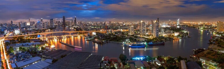 Fototapeta premium Aerial view of Bangkok City skyline by Chao Phraya River in Thailand 