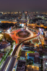 Fototapeta na wymiar aerial view of highway junctions with roundabout. Bridge roads shape circle in structure of architecture and transportation concept. Top view. Urban city, Bangkok at sunset, Thailand.