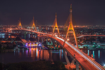 Fototapeta na wymiar Aerial view of Bhumibol Bridge and Chao Phraya River in structure architecture concept, Urban city, Bangkok. Downtown area at night, Thailand 