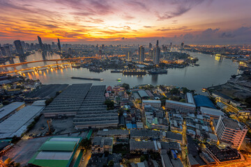 Naklejka premium Aerial view of Bangkok City skyline by Chao Phraya River in Thailand 